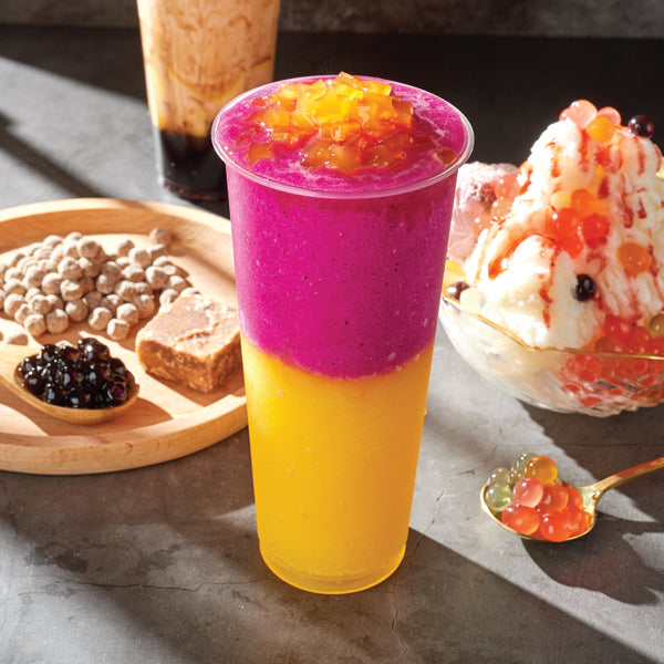 Dragon Fruit Syrup drink with dessert and tapioca pearls in the background view 3